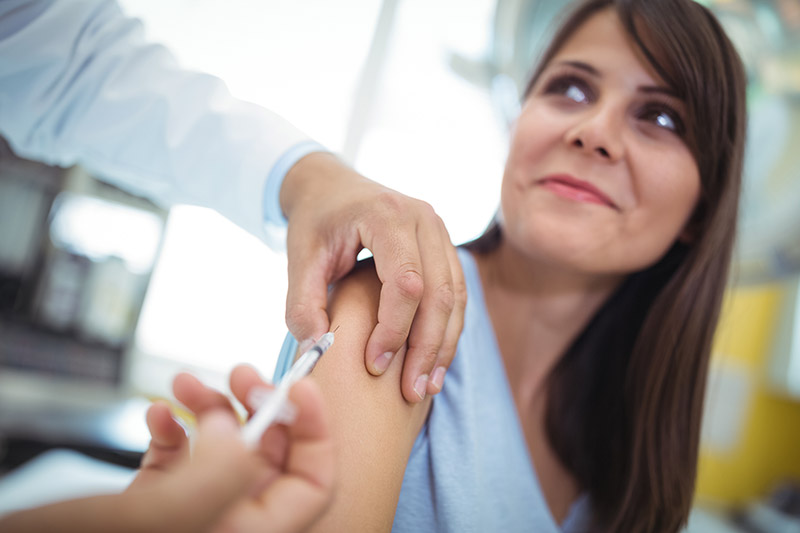 Photo of doctor giving patient an injection