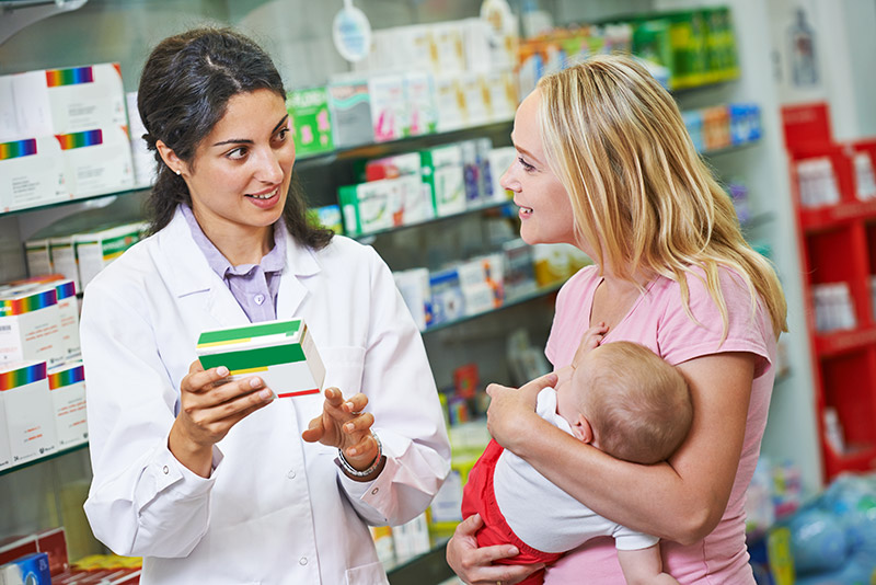 Photo of pharmacists giving customer advice on medication