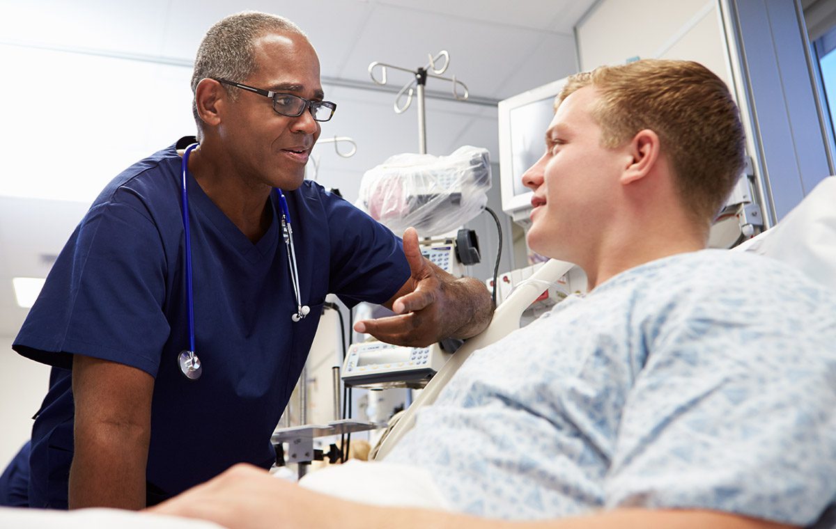 Photo of doctor conversing with patient